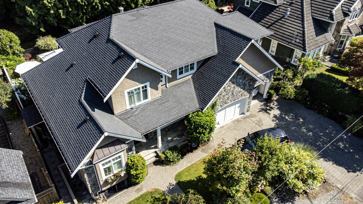 A shot of a single house from the top. Exterior painting example of Armstrong Custom Decoring